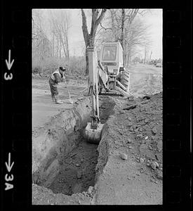 Excavator digging a hole