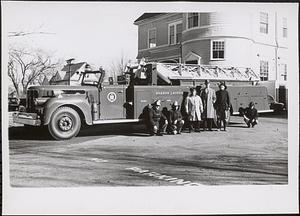 Fire Department truck, with fire department personnel in the front