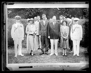 A group of people that include Lou and Herbert Hoover as well as Charles and Anne Lindbergh