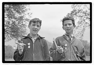 Two boys wearing medals