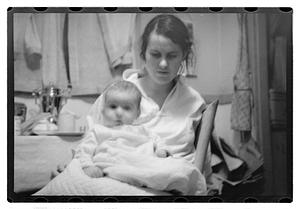 Maude Sanromá holding a baby on her lap