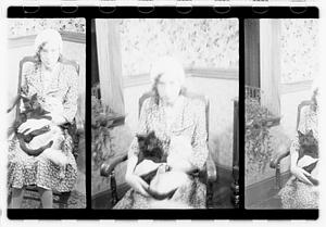 Unidentified woman holding cats