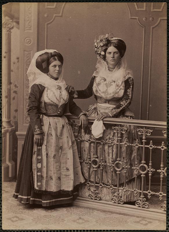 Studio portrait of two women in traditional Greek dress