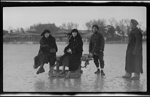 Group of men and women on frozen lake in front of Winter Palace
