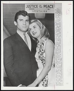 Denied Marriage License--Beverly Aadland, one time companion of the late Errol Flynn, was denied a marriage license here last night when she was unable to produce proof that she was 18 years old. Beverly and her fiance, Maurice de Leon,22, are seen above before they received the bad news. De Leon is an industrial designer for the Los Angeles Board of Education.