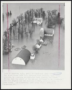 Farmyard Lake--The flooding Red River moved over this farmyard near Drayton, N.D. This picture, by Winnipeg photographer Dave Bonner, was taken Friday when the crest of the Red was believed to be somewhere between Drayton and the Manitoba border, about 40 miles to the north.