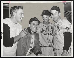 Cardinals' Star Rookie Pitcher and his helpers put on their victory smiles after beating the Braves last night, 5-2, at the Wigwam. Tom Poholsky (second from left) held the Tribe to six hits, while Steve Bilko (left) and Stan Musial (second from right) hit homers and Joe Garagiola (right) hit a double to account for the Cards five runs.