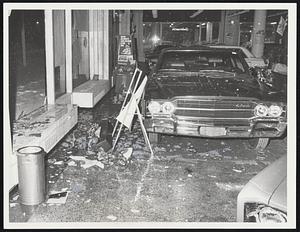 Snow Swirls in on cars in showroom of Back Bay Rambler on Commonwealth avenue after plate glass window was blown in by continued strong winds during storm.