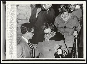 Federal marshal Ron Dombrowski escorts two members of the Chicago 7 jury, Mrs. Ruth L. Petersen, front, and Mrs. Mildred Burns, from the service entrance of a Chicago hotel Wednesday after they were released from duty. The women, both housewives, were members of a jury that found five political activist guilty of coming to Chicago to incite riots at the time of the 1968 Democratic National Convention.