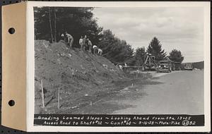 Contract No. 60, Access Roads to Shaft 12, Quabbin Aqueduct, Hardwick and Greenwich, grading loamed slopes, looking ahead from Sta. 13+25, Greenwich and Hardwick, Mass., Sep. 16, 1938