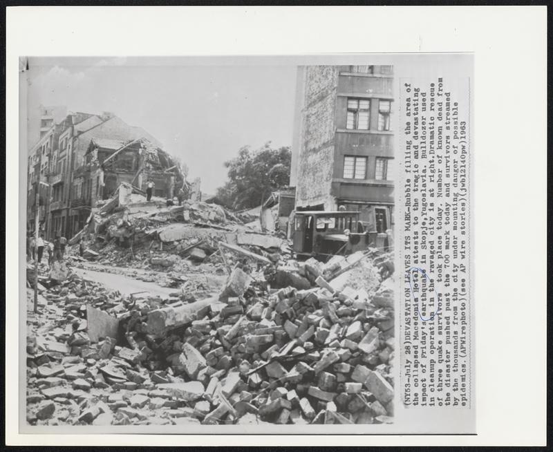 Devastation Leaves Its Mark -- Rubble filling the area of the collapsed Macedonia Hotel attests to the tragic and devastating impact of Friday's earthquake in Skopje, Yugoslavia. Bulldozer used in cleanup operation in the ravaged city is at right. Dramatic rescue of three quake survivors took place today. Number of known dead from the disaster pushed past the 700 mark today and survivors streamed by the thousands from the city under mounting danger of possible epidemics.