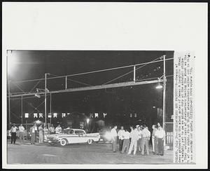 Steelworkers End Production--Groups of [illegible] gathered at the plant gates of Jones & Laughlin Steel [illegible] tonight, set to go on picket duty at the midnight strike [illegible] They watched cars of steelworkers leaving the plant on the [illegible] of the night. About 90,000 steelworkers walked out in Ohio [illegible] was orderly and quiet.