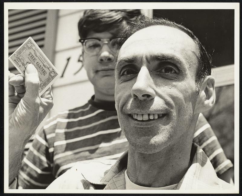Man with lottery ticket