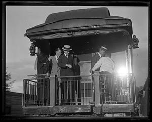 Pres. and Mrs. Coolidge and son John leaving Ludlow, VT station on route to Capitol
