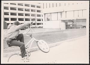 Boy doing bike tricks