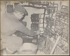 Man testing wiring at Clark-Aiken