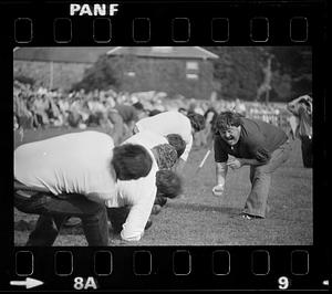 Man yells at tug of war competitors
