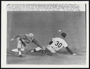 Dodger Maury Wills steals second in the 5th inning here and took third as Cincinnati Reds second baseman Pete Rose was unable to get catcher John Edwards throw, the ball going over his glove and out to center field. Willis, who had walked originally, scored on Jim Gilliam's infield grounder. The LA Dodgers ran over the Reds 6-1 here 9/27 to hold onto their first place tie with San Francisco.