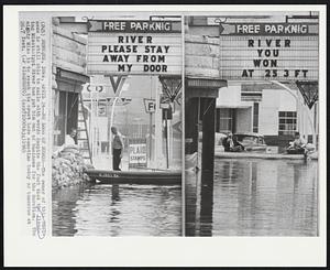 No Loss of Humor--The owner of this business is still able to smile with words despite the fact that the flooding Mississippi River has put him out of business for the duration. The mighty Miss is to reach its crest here sometime today or tomorrow at 26.7 feet.