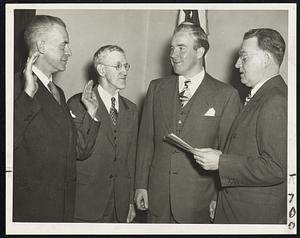 New City Officials - Left to right are: Maj. William W. Drummey, new transit commission chairman; Patrick O'Connor, new superintendent of public buildings; Mayor John E. Kerrigan, who made the appointments, and Asst. City Clerk John B. Hynes, who swore in the new officials.