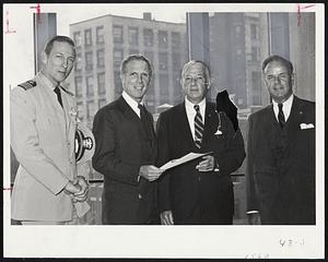 Navy Day Celebrations are being this week under a proclamation signed by Mayor Kevin H. White before his recent illness. left: Captain Mac A. Graham, USN, Chief of First Naval District; White; Leo C. Graham, president of the Boston Council of Navy League and Asa E. Phillips Jr., recently Navy League vice president and chairman of the Boston Council's Navy Day Committee.