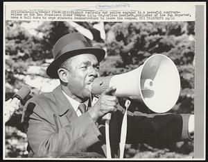 Students radicals and police engaged in a peaceful confrontations on the San Francisco State campus 12/4. Dr. Carlton Goodlett, publisher of the Sun Reporter, uses a bull horn to urge students demonstrators to leave the campus.