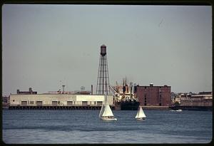 Sailboats passing by East Boston Pier No. 1