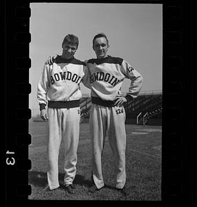 Bowdoin pole vaulter Henry Bunting and unidentified athlete at track meet