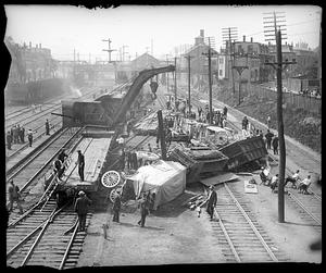 Crane being used to clear wreckage after a derailment