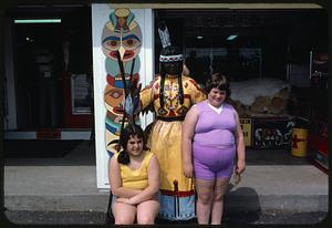 Children posing with statue of Native American, Mohawk Tepee souvenir shop, Charlemont, Massachusetts