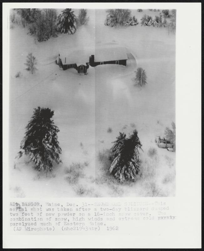 Bangor, Maine. - Snowbound Solitude - This aerial shot was taken after a two-day blizzard dumped two feet of new powder on a 16-inch snow cover. The combination of snow, high winds and extreme cold paralyzed much of Eastern Maine.