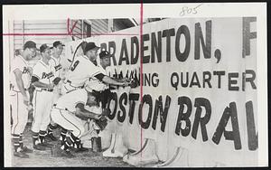 Jolly Braves Depart – A group of Braves players, apparently far from downhearted at their shift to Milwaukee, touch up fence outside Bradenton training field, changing name to Milwaukee Braves. Left to right, Ed Mathews, Andy Pafko, Gene Conley, Joe Adcock, Vern Bickford, and in front, Johnny Logan.