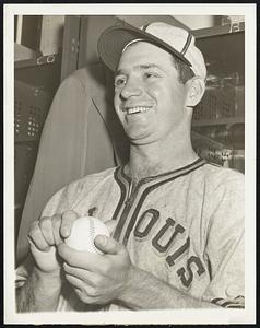 Pretty Good Job, Says He. Emil Baldilli, 25-year-old St. Louis Browns fledgling pitcher, is shown above after he hurled two-hit ball against the New York Yankees April 30 in their park. The blister on his throwing hand thumb and the cold that corked up his head were forgotten as he posed triumphantly in front of his locker. Charley Keller, Yankee outfielder, gave Bildilli the most trouble, he admitted. The Browns won, 2 to 1.