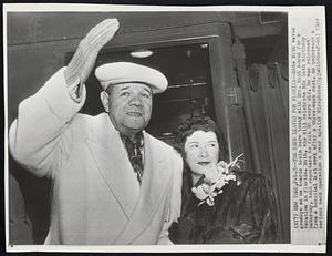 The Babe Leaves for Florida -- Babe Ruth waves goodbye as he boards train here today with Mrs. Ruth bound for a vacation in Florida. Ruth, who will celebrate his 54th birthday Saturday, told reporters he felt 90 years old. He was released from hospital last week after a three-week rest. He underwent a serious neck operation a year ago.