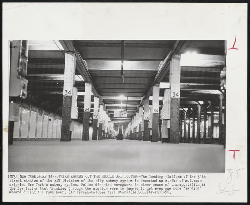 Strike Knocks Out the Hustle and Bustle -- The loading platform of the 34th Street station of the BMT Division of the city subway system is deserted as strike of motormen crippled New York's subway system. Police directed homegoers to other means of transportation as the few trains that trickled through the station were to jammed to get even one more "sardine" aboard during the rush hour.