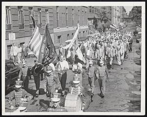 Teamsters on Parade--Members of the Teamsters Union, Local 25, AFL, march along East Newton street to the armory from second annual memorial mass at Immaculate Conception Church. Communion breakfast was held in armory.