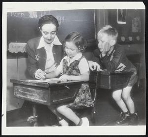 It's Back to School for Buffalo's youngsters, now that the teachers' strike is settled. Thes etiny first-graders, who never did understand the week's vacation, are back in the classroom of Miss Mary L. Collins.