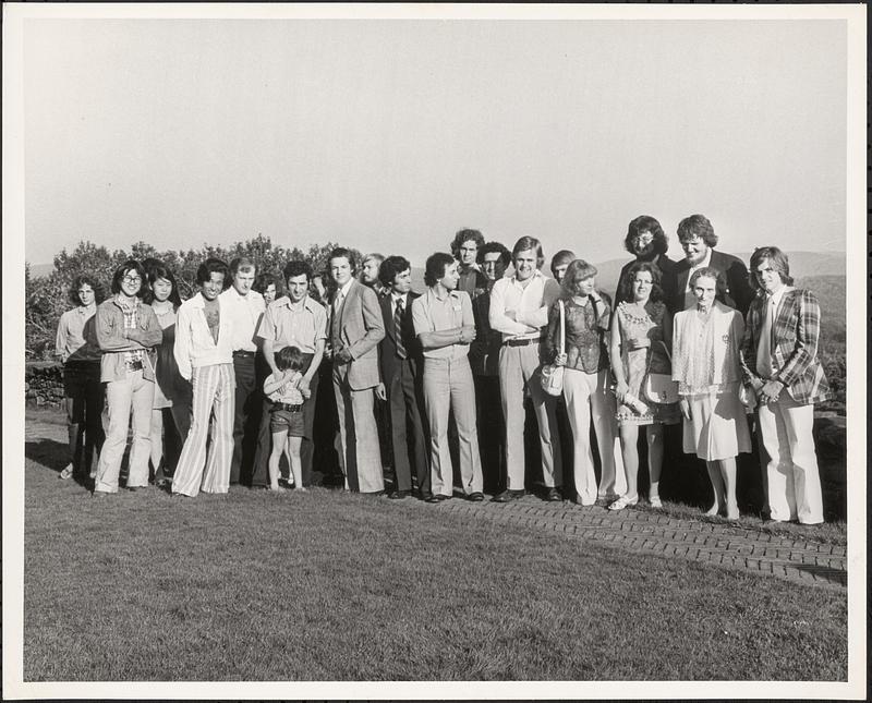 Olga Koussevitzky poses with large group of people, possibly at Tanglewood