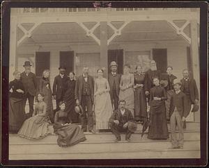 Group of people posed on porch