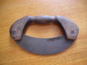 Curved blade tool on wood