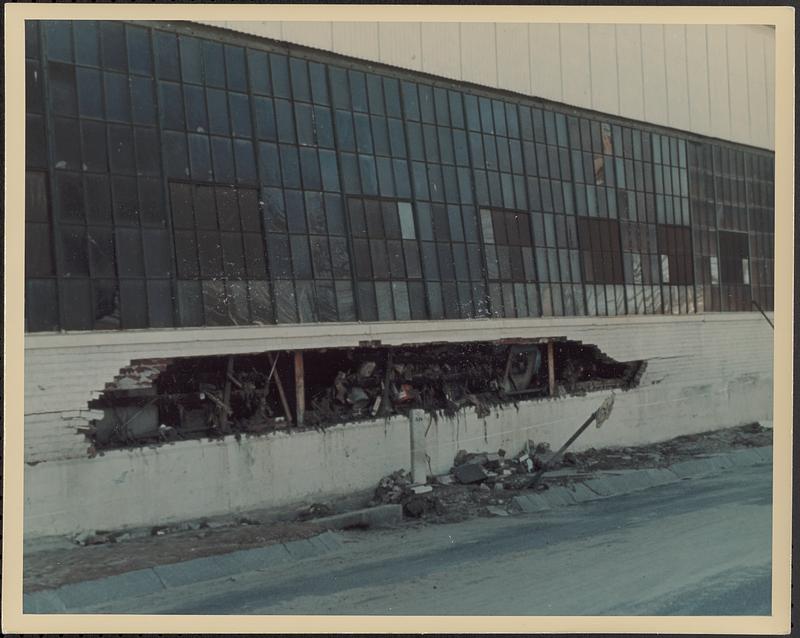 Exterior of building with flood damage to lower half