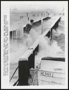 Hyannis, Port Mass. This daring youngster shown on the Hyannis Port Yacht Club pier watches water come up higher and higher here, 11/30.