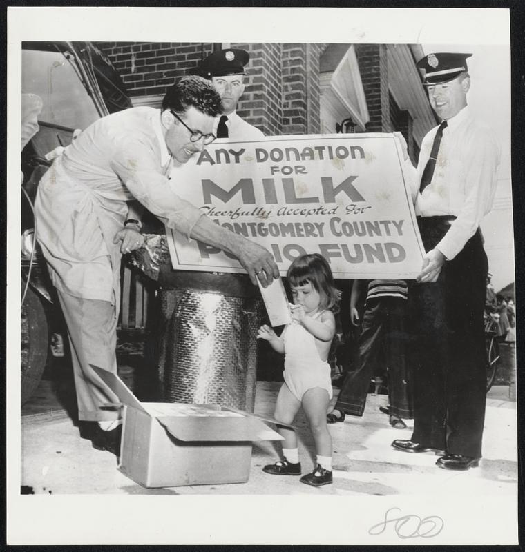 Free Milk for Children with donations being accepted for an infantile paralysis fund was a popular attraction in Washington yesterday. Groces Hy Posin, (left) bought the milk in Baltimore for sale in his store, the gave milk away when regulations prevented its sale in the District.