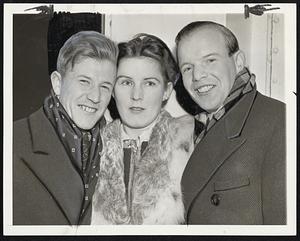 Ski Champions Arrive. Birger Ruud of Norway (left) one of the world's greatest skiers, is shown with his bride and his brother Sigmund as they arrived in New York Jan. 11 aboard the liner Europa. Birger won the international olympics championship in 1932, and Sigmund is American champion. They'll enter the international jumping tournament in Chicago Jan. 16.