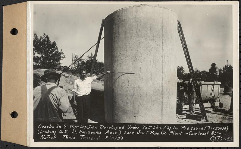 Contract No. 85, Manufacture and Delivery of Precast Concrete Steel Cylinder Pipe, Southborough, Framingham, Wayland, Natick, Weston, cracks in 7 foot pipe section developed under 325 lbs./sq. in pressure, 3:15 PM, looking southeast at horizontal axis, Natick, Mass., Aug. 11, 1939