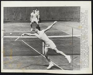 Schroeder Stretches for Return--Ted Schroeder (forecourt) stretches to make return today in his match with Frank Sedgman of Australia. Schroeder downed Sedgman, 6-4, 6-4, 6-3. His victory and that of Pancho Gonzales over Billy Sidwell gave the U.S. a 4-1 edge to retain the Davis Cup.