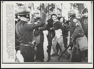 Police Break Up Picket Line--San Francisco police arrest San Francisco State College students after breaking up a picket line of striking students today in front of the Business Administration Buildings. The police moved in on the striking group which has kept the college closed for nearly a month. The school was reopened Monday.