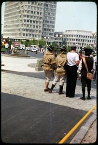 A group of people in colonial costume near City Hall