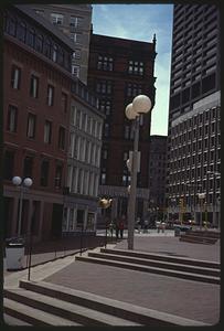 Giant tea kettle sign, Court and Tremont Streets, bank in background, Boston