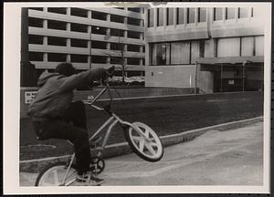 Boy doing bike tricks